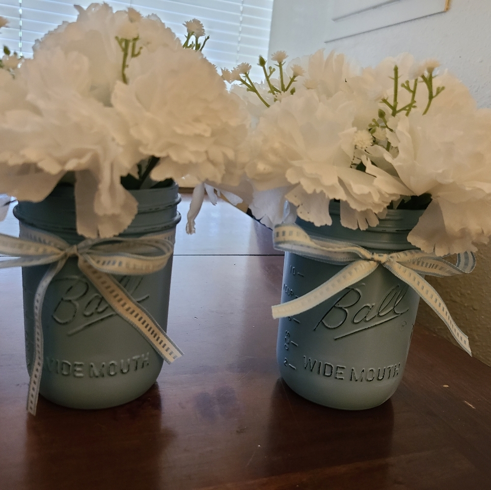 Set of two mason jars with fake flowers